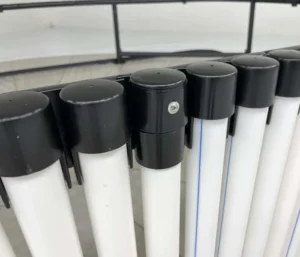 Black and white vertical rods with caps.