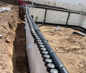 Pool construction site with exposed foundation walls.